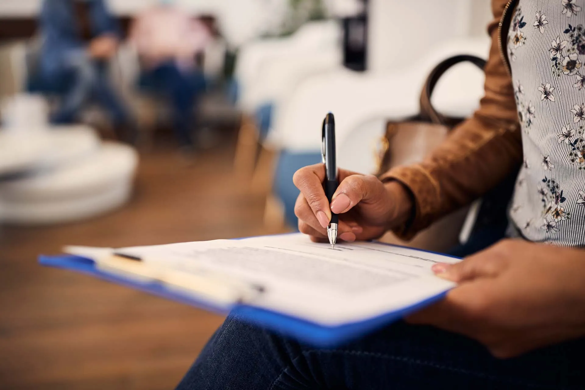 Patient signing a financing form at the office